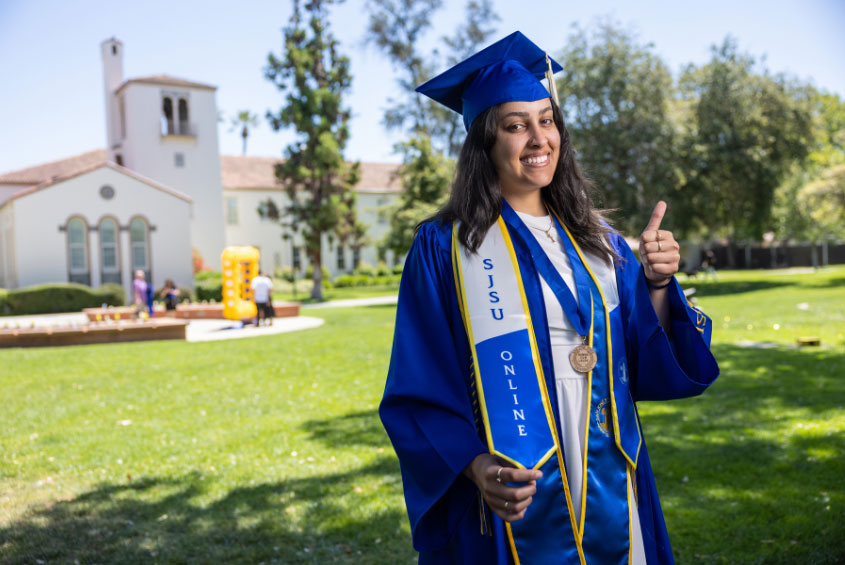 SJSU Online graduate in their regalia.