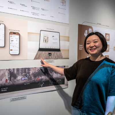 Designer Yulie Dai posing with her work.