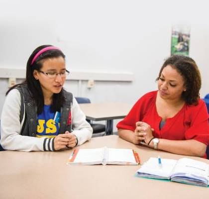 Tutor helping student