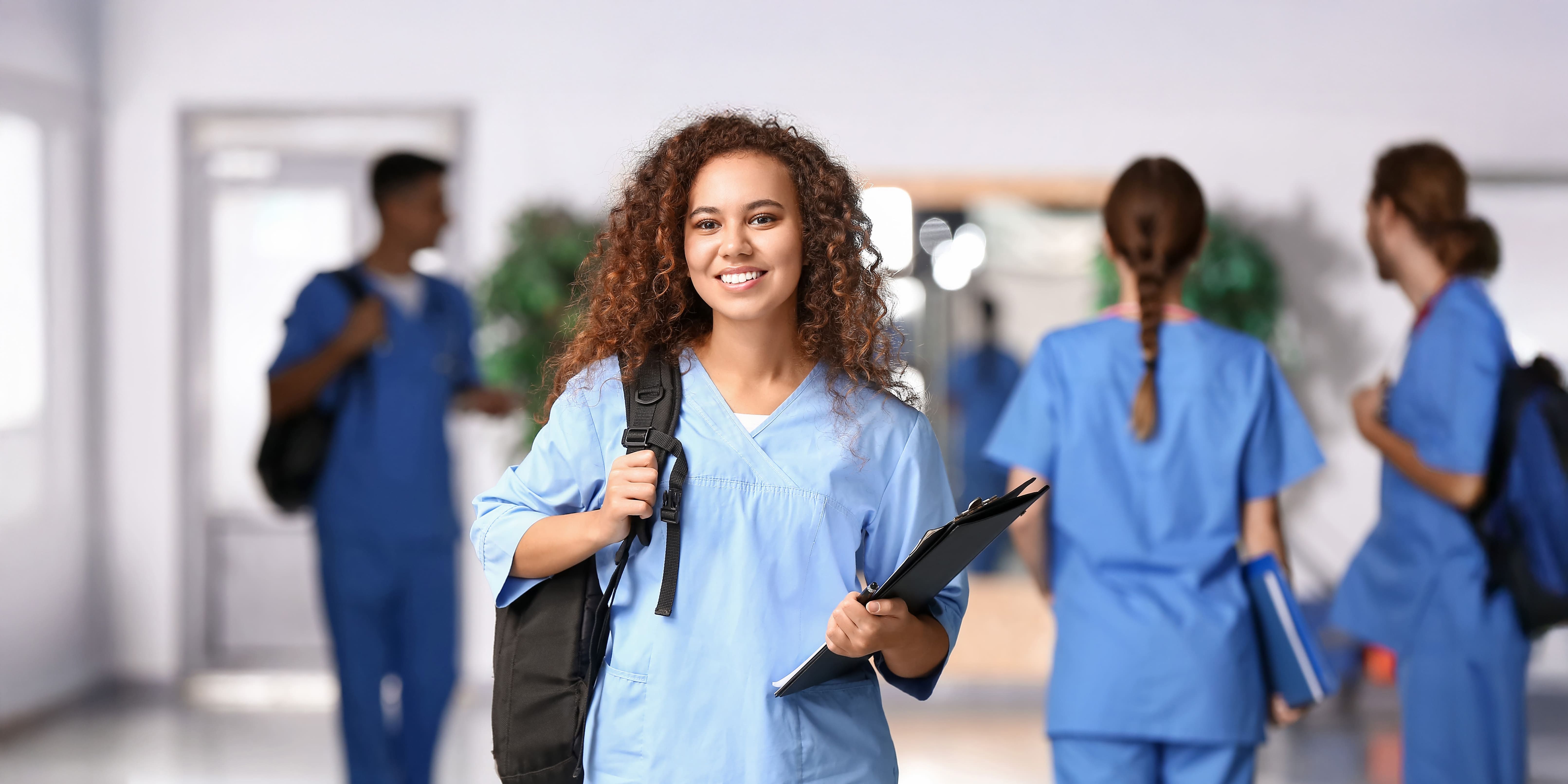 Public health student wearing scrubs